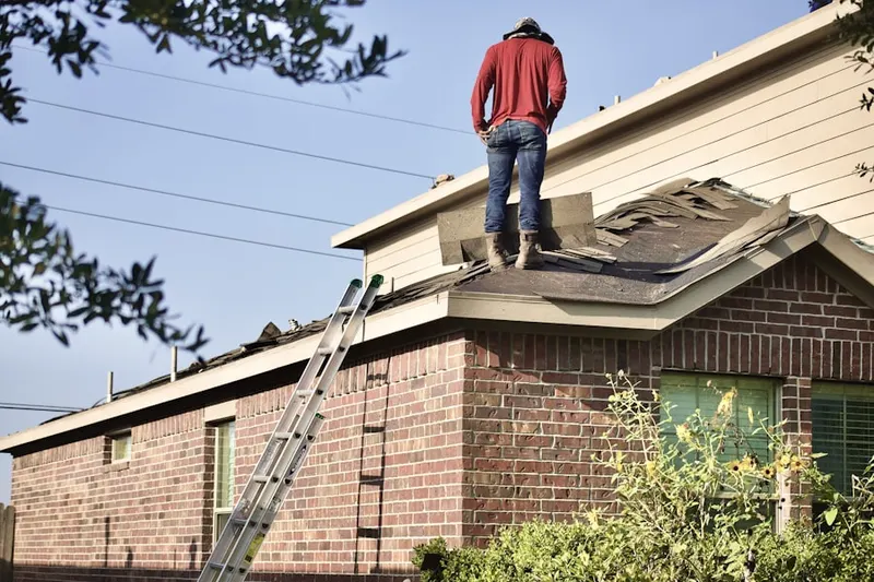 Professional roofer working on a residential roof in Blackfoot